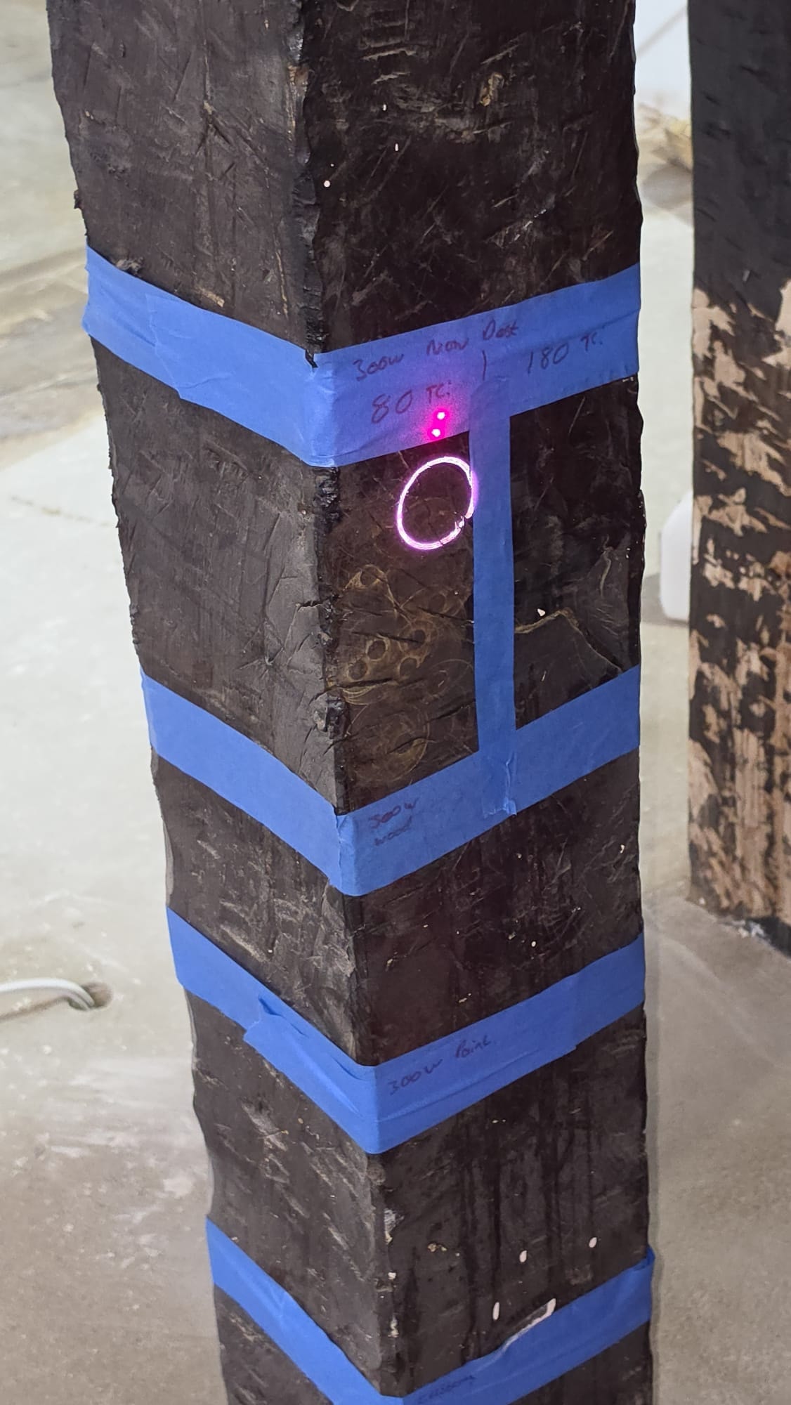Oak beam before laser cleaning — paint and staining on historic timber